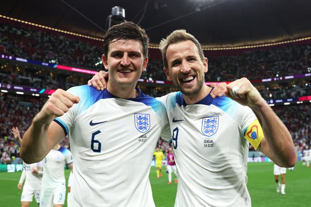 <p>Harry Maguire, left, and Harry Kane celebrate </p>