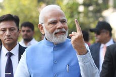 ‘Festival of democracy’: Indian PM Modi casts his vote as crucial home state goes to poll
