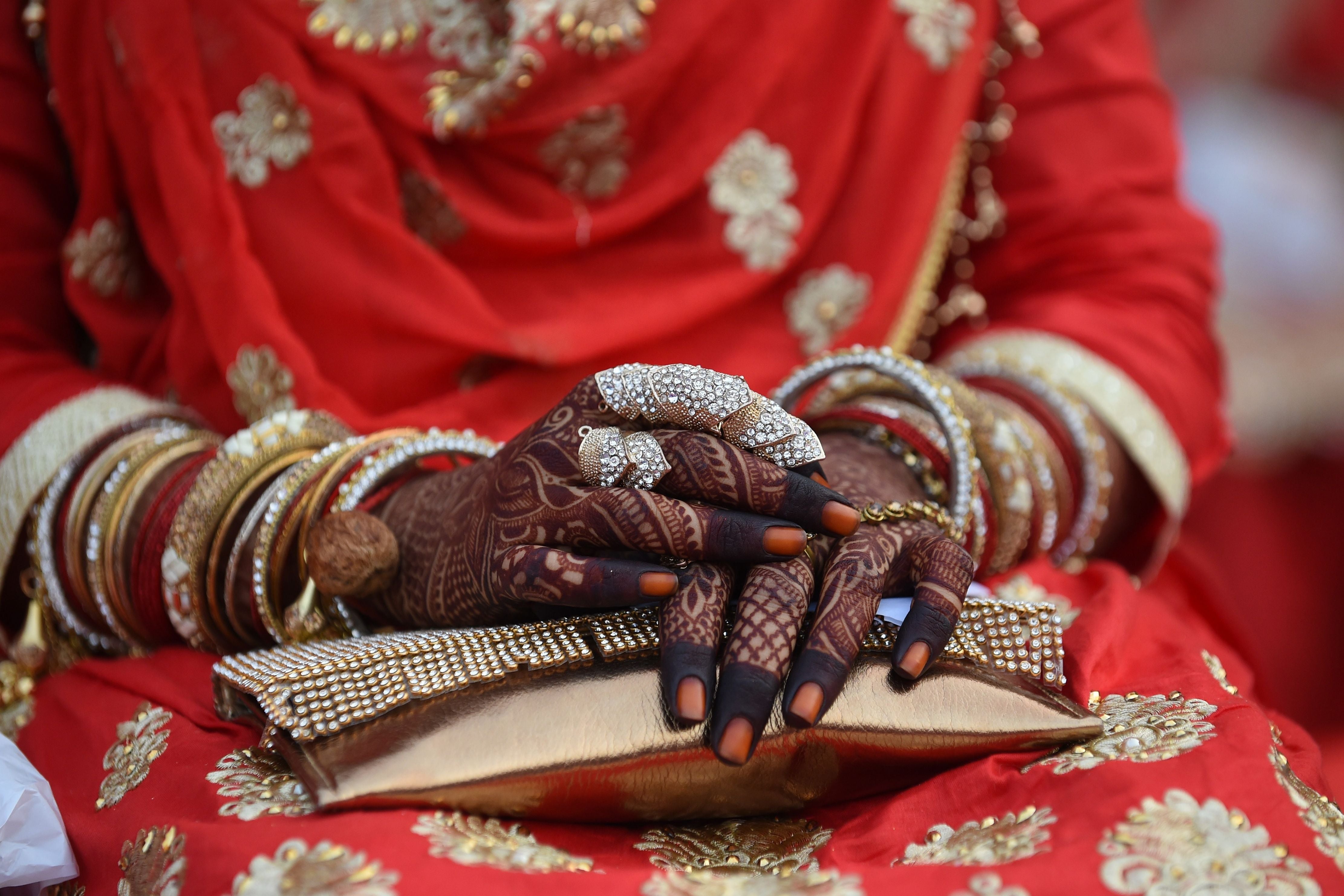 Representative: An Indian bride’s hands decorated with henna