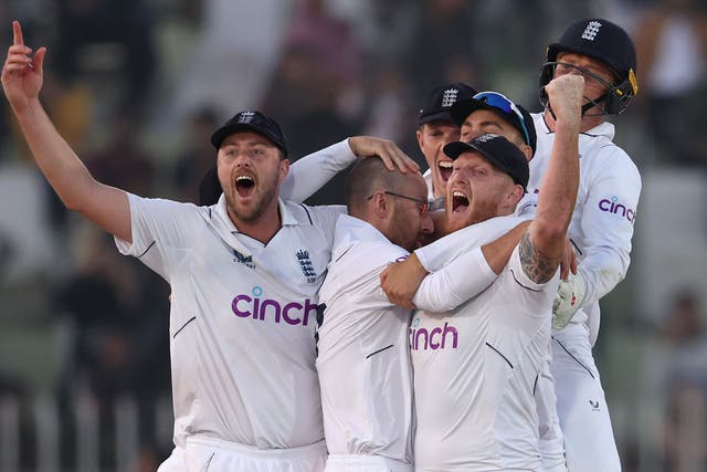 <p>Ollie Robinson, Jack Leach and Ben Stokes of England celebrate winning the First Test Match</p>