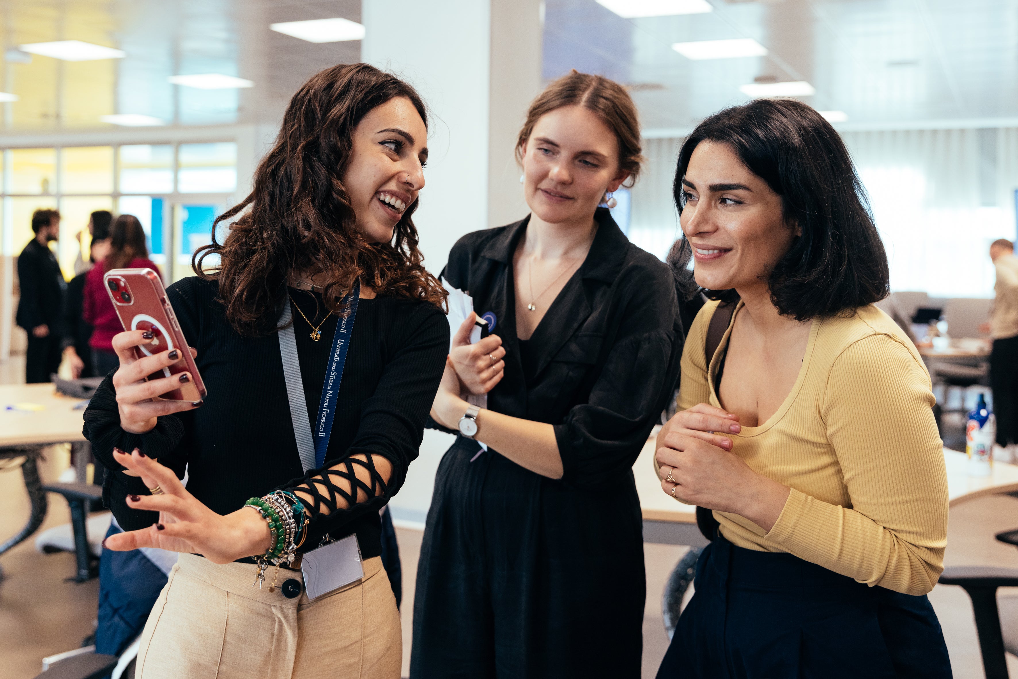 An Apple Developer Academy student shows their app to Melissa Würtz Azari, co-founder and CPO, and Signe Bentzen, Lead Product Designer, of Tiimo