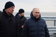 Putin drives across Crimea bridge badly damaged in October bomb attack