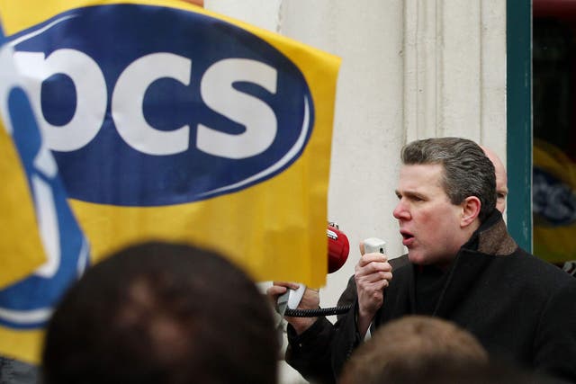 Mark Serwotka, General Secretary of the Public and Commercial Services Union, speaks to members as they strike outside the Cabinet Office in Whitehall, London, in a row over terms and conditions pay and pensions.