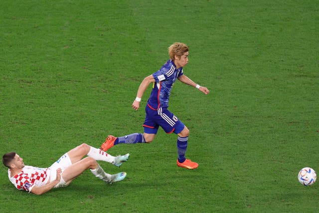 <p>Junya Ito leaves behind Andrej Kramaric in Japan’s clash with Croatia</p>