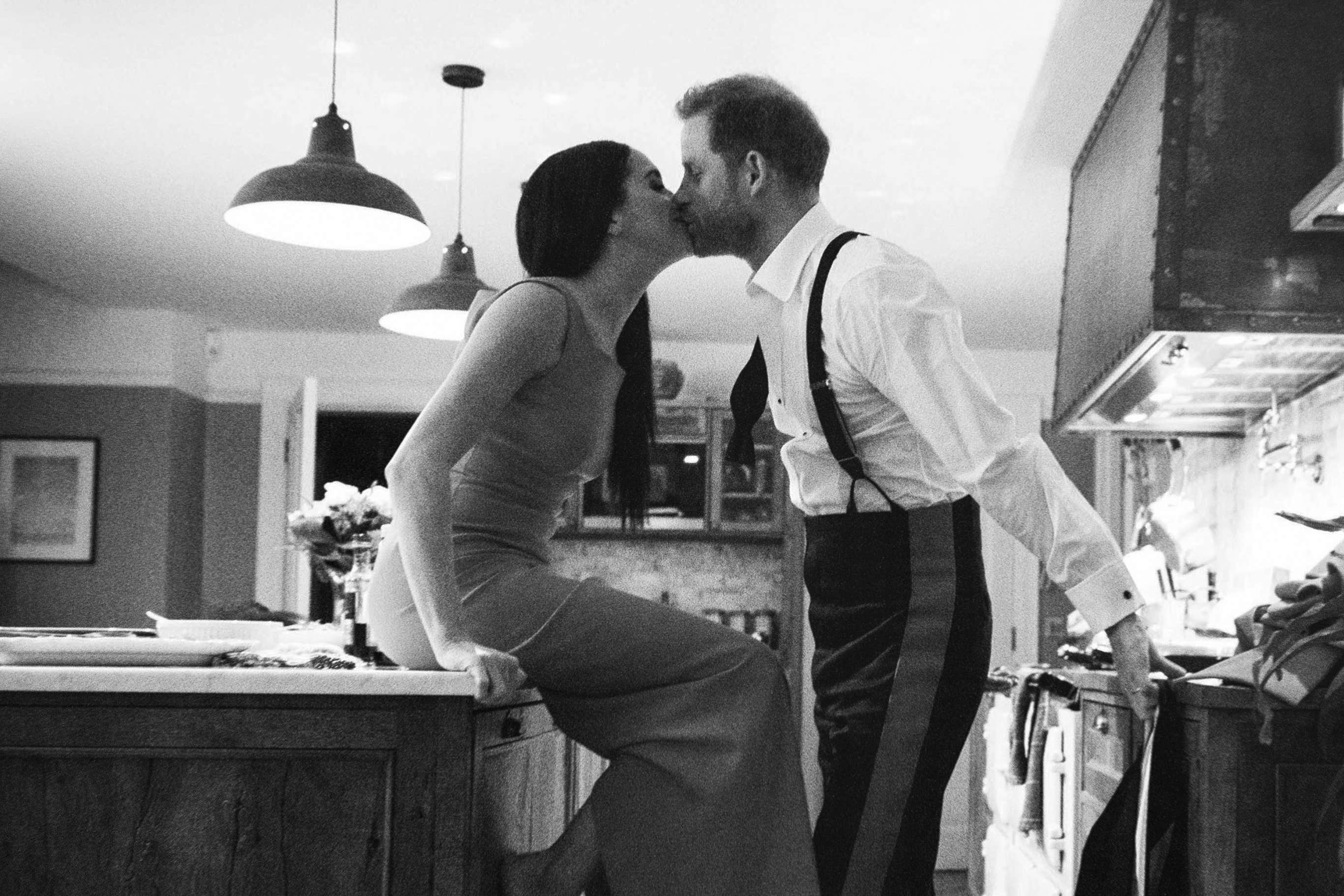 The Duke and Duchess of Sussex kissing in a kitchen. The picture is part of a trailer for a new documentary called ‘Harry and Meghan’ – the Sussexes’ behind the scenes (Duke and Duchess of Sussex/Netflix/PA)