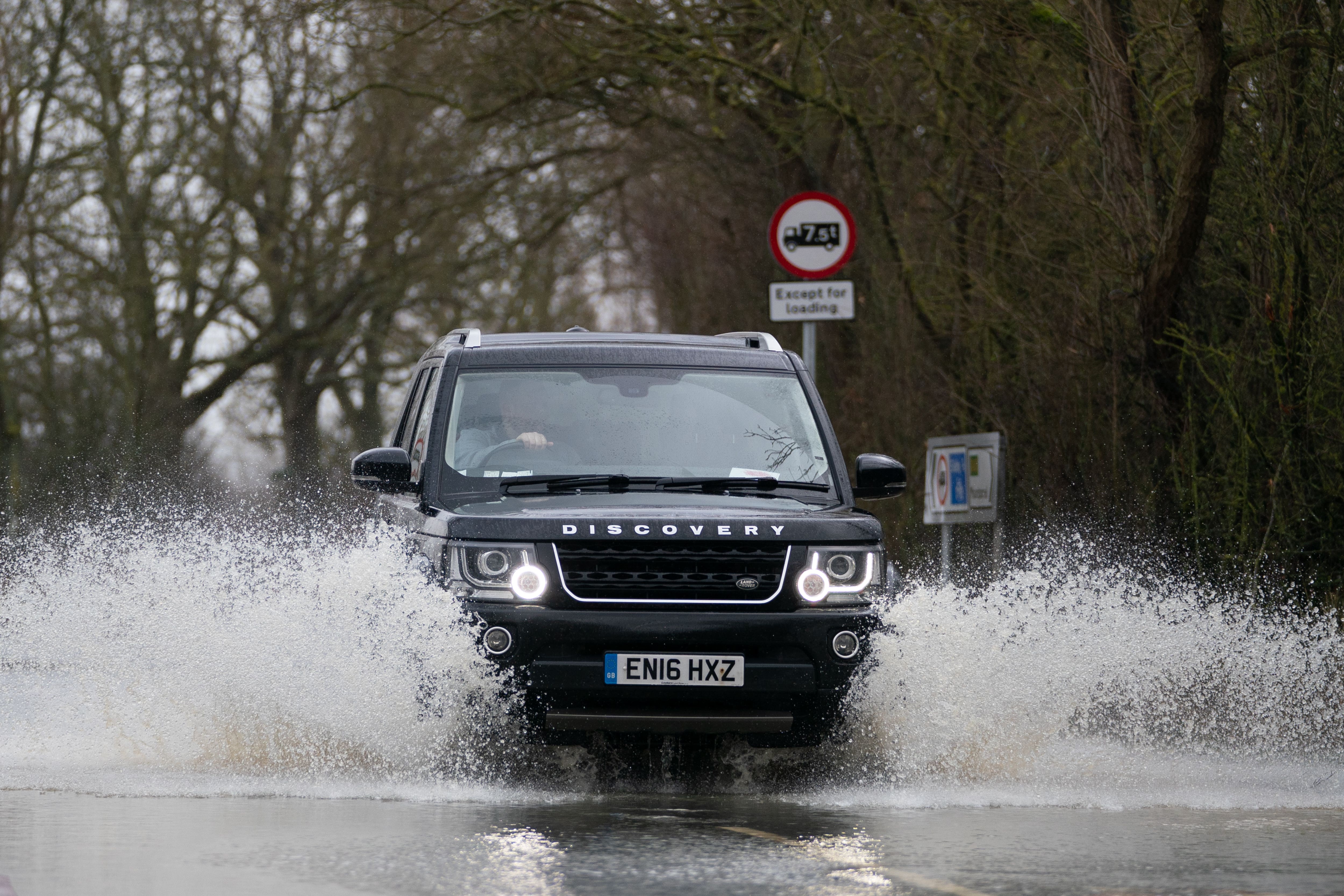 More than one in six motorists admit they would not change their driving plans despite a red weather warning, a new survey suggests (Joe Giddens/PA)