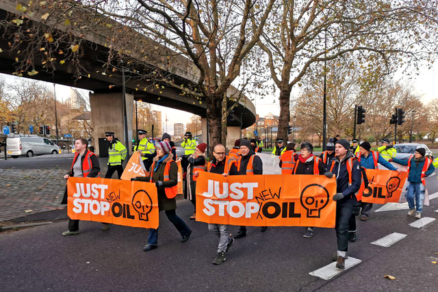 Just Stop Oil protesters marched in the road in south London on Tuesday morning (Just Stop Oil/PA)