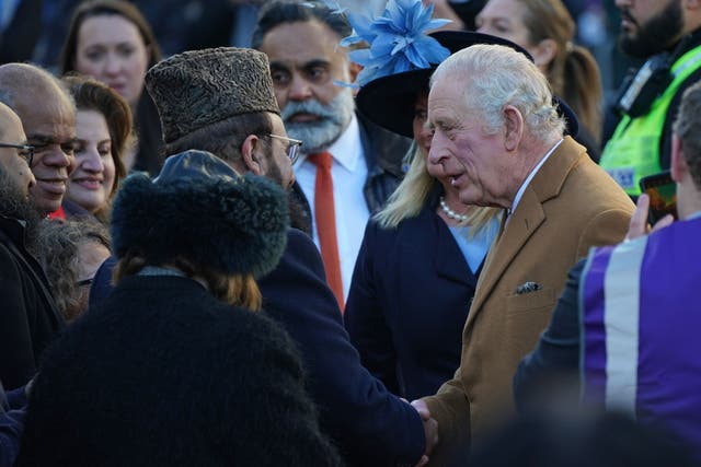 The King meets members of the public as he arrives for a visit to Luton Town Hall (Yui Mok/PA)