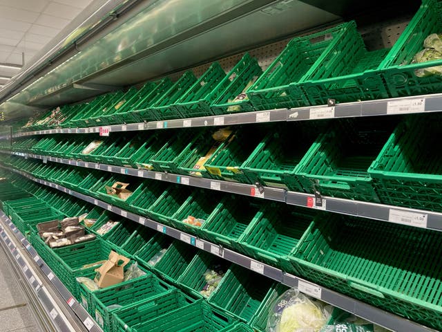 <p>File photo: Empty produce shelves at a Co-op supermarket in December last year </p>