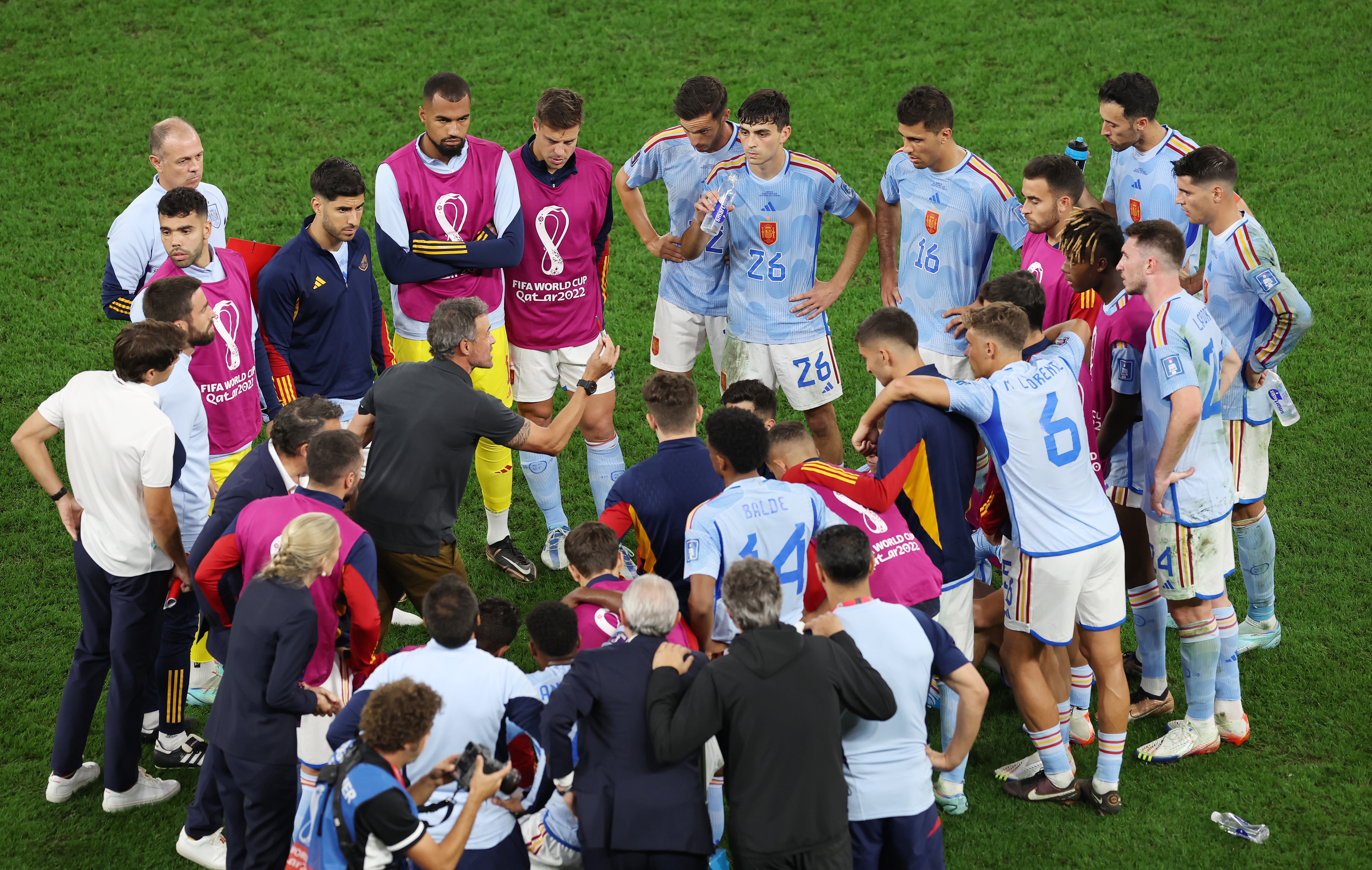 Luis Enrique addresses his players before their shootout against Morocco