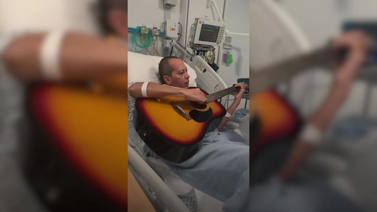 Patient plays guitar in hospital bed after having first UK double lung transplant for Covid complications