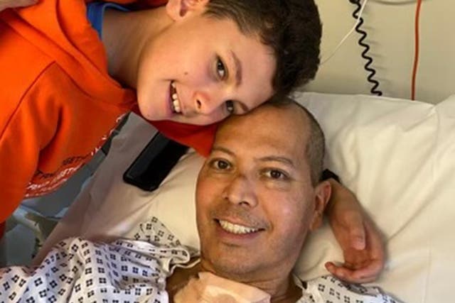 <p>Cesar Franco, 50, with son Gabriel after the surgery </p>