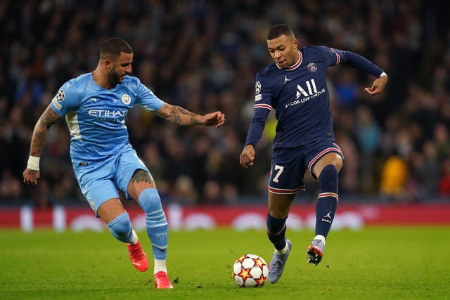 Kyle Walker, left, will be tasked with stopping Kylian Mbappe (Martin Rickett/PA)