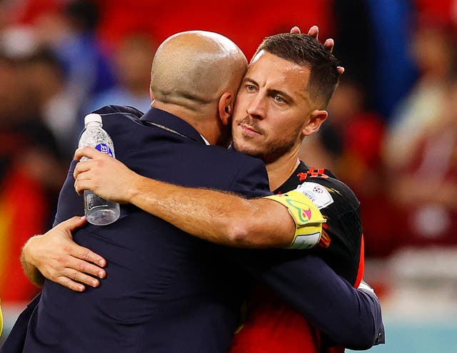 <p>Eden Hazard embraces Roberto Martinez after exiting the World Cup</p>