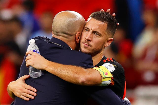 <p>Eden Hazard embraces Roberto Martinez after exiting the World Cup</p>
