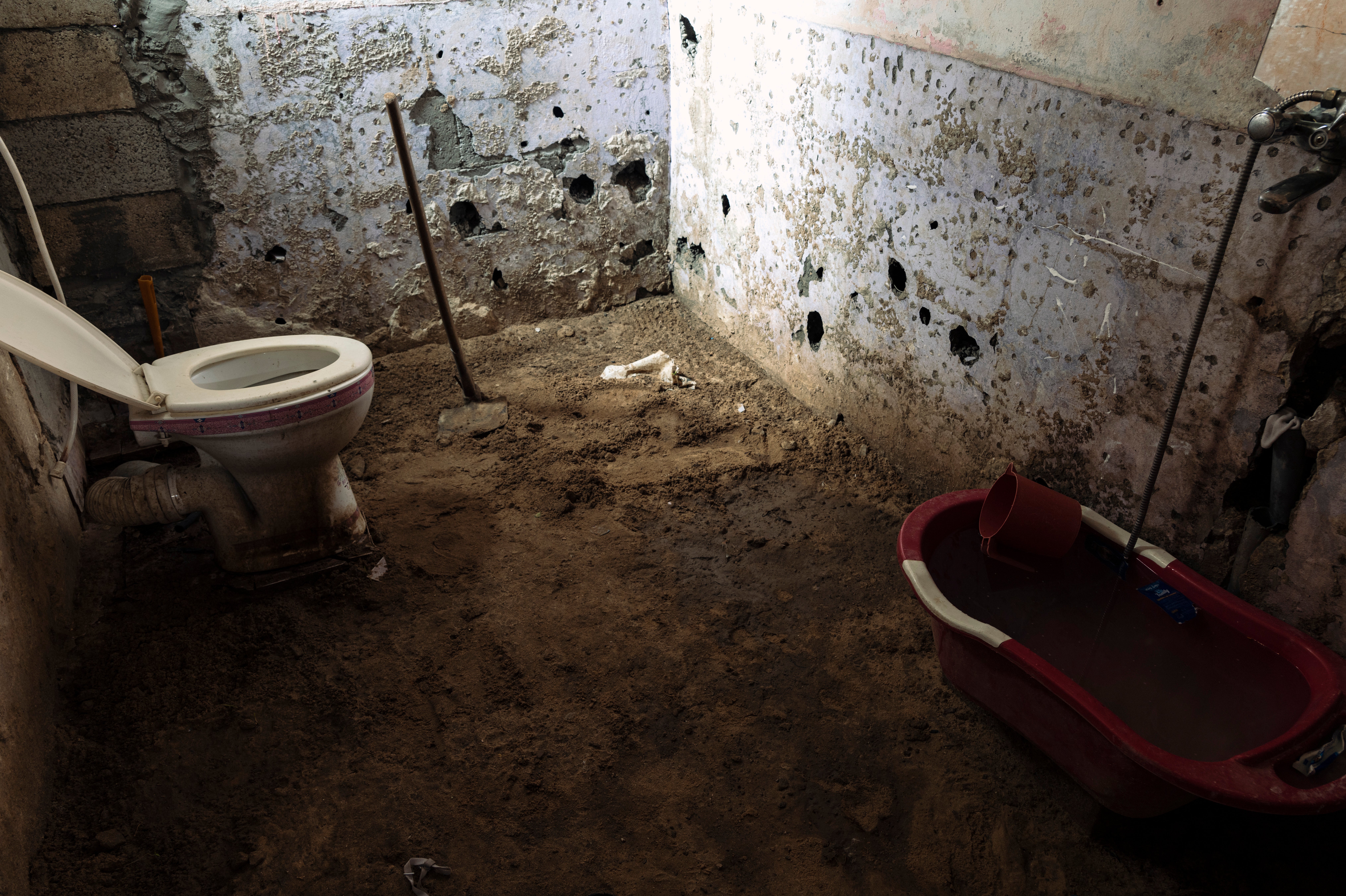A family bathroom in an informal makeshift dwelling near Khan Younis