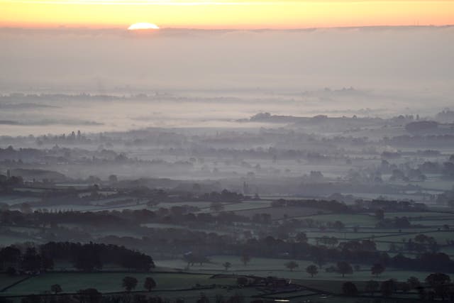 The sun rises over a foggy Worcestershire as seen from the Malvern Hills, with the UK is bracing itself for a week of very cold weather (Jacob King/PA)