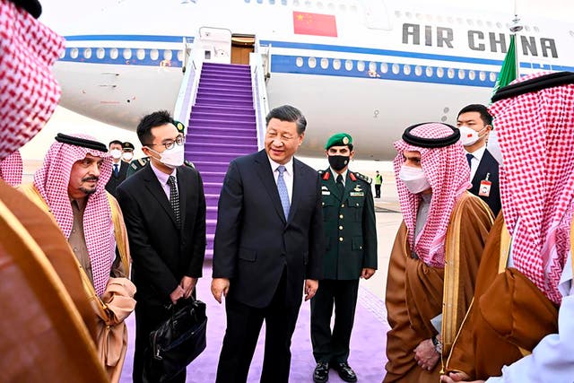 <p>Chinese president Xi Jinping, centre, greeted by Prince Faisal bin Bandar bin Abdulaziz, governor of Riyadh, after his arrival in Riyadh, Saudi Arabia</p>