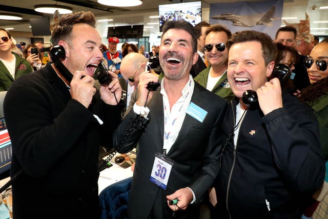 Ant McPartlin and Declan Donnelly with Simon Cowell at ICAP headquarters in London during the broker’s 30th annual charity day, raising money for charities across the globe (Will Wintercross/PA)