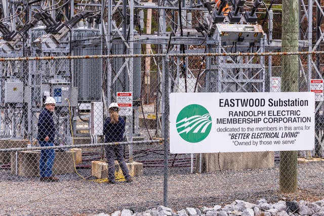 <p>Workers  repair the Eastwood Substation in West End, North Carolina, after deliberate attacks on electrical substations in Moore County last Saturday evening. </p>