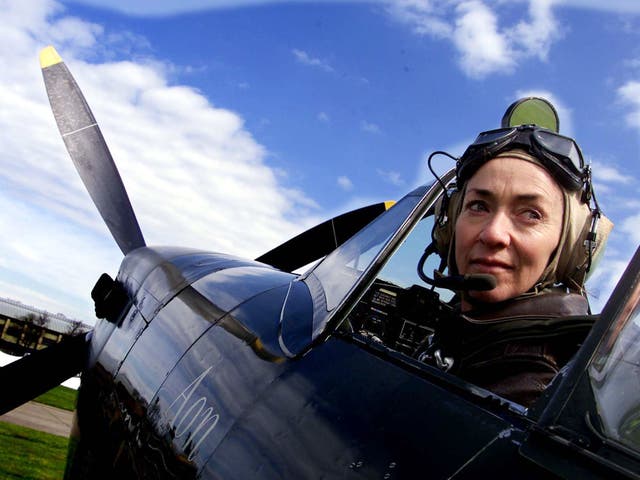 <p>Carolyn Grace in the cockpit of the Spitfire she flew in airshows</p>