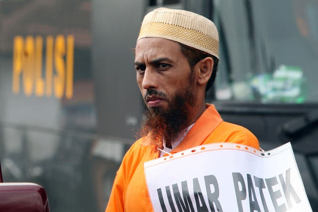 <p>Convicted Muslim militant Umar Patek pauses during the police reenactment of the scenes leading to the 2002 Bali bombing, in Denpasar, Bali Indonesia in 2011 </p>