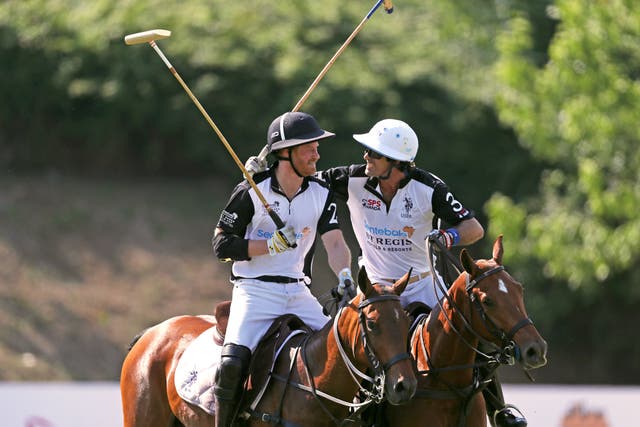 The Duke of Sussex and Nacho Figueras take part in the Sentebale ISPS Handa Polo Cup at the Roma Polo Club in Rome, Italy (Steve Parsons/PA)