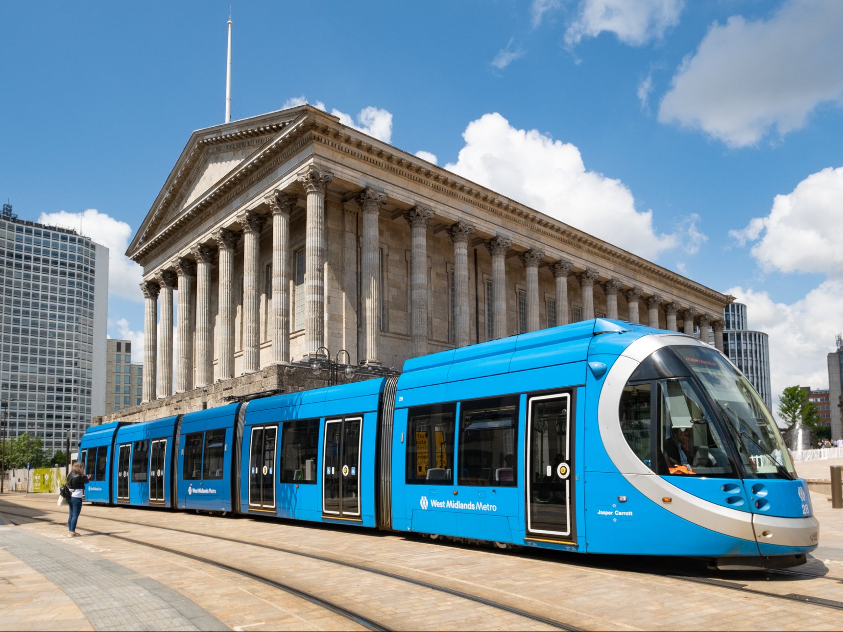 A West Midlands Metro tram in front of Birmingham Town Hall in Victoria Square. The system currently has one line, running between Birmingham and Wolverhampton