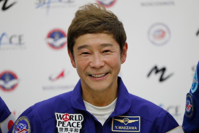 <p>Yusaku Maezawa attends a news conference ahead of his expedition to the International Space Station in 2021 </p>