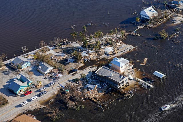 <p>The bridge leading from Fort Myers to Pine Island, Fla., is seen heavily damaged in the aftermath of Hurricane Ian on Pine Island, Fla., Oct. 1, 2022. This past year has seen a horrific flood that submerged one-third of Pakistan, one of the three costliest U.S. hurricanes on record, devastating droughts in Europe and China, a drought-triggered famine in Africa and deadly heat waves all over. (AP Photo/Gerald Herbert, File)</p>