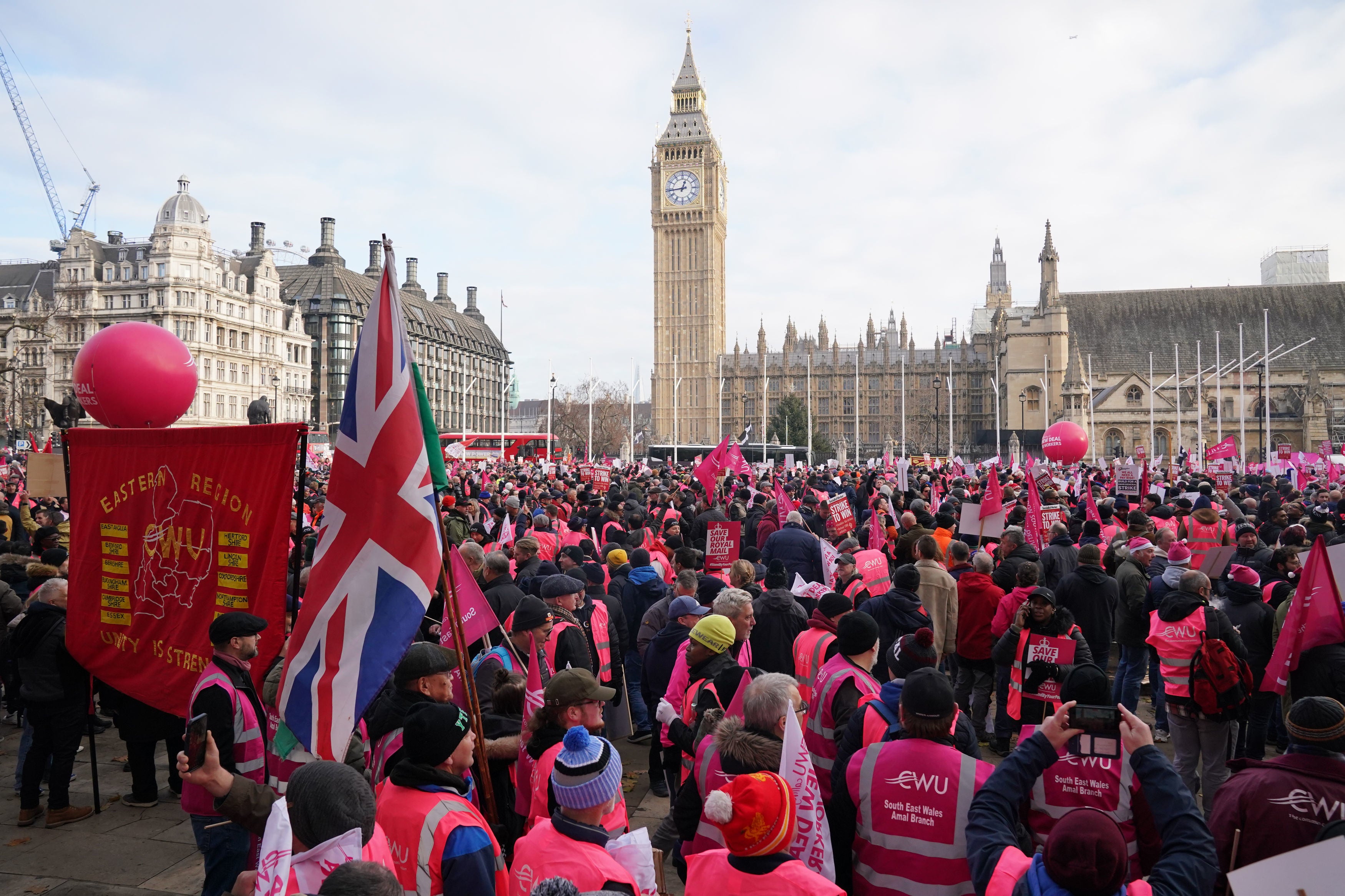 Members of the Communication Workers Union (CWU) hold a rally in Parliament Square