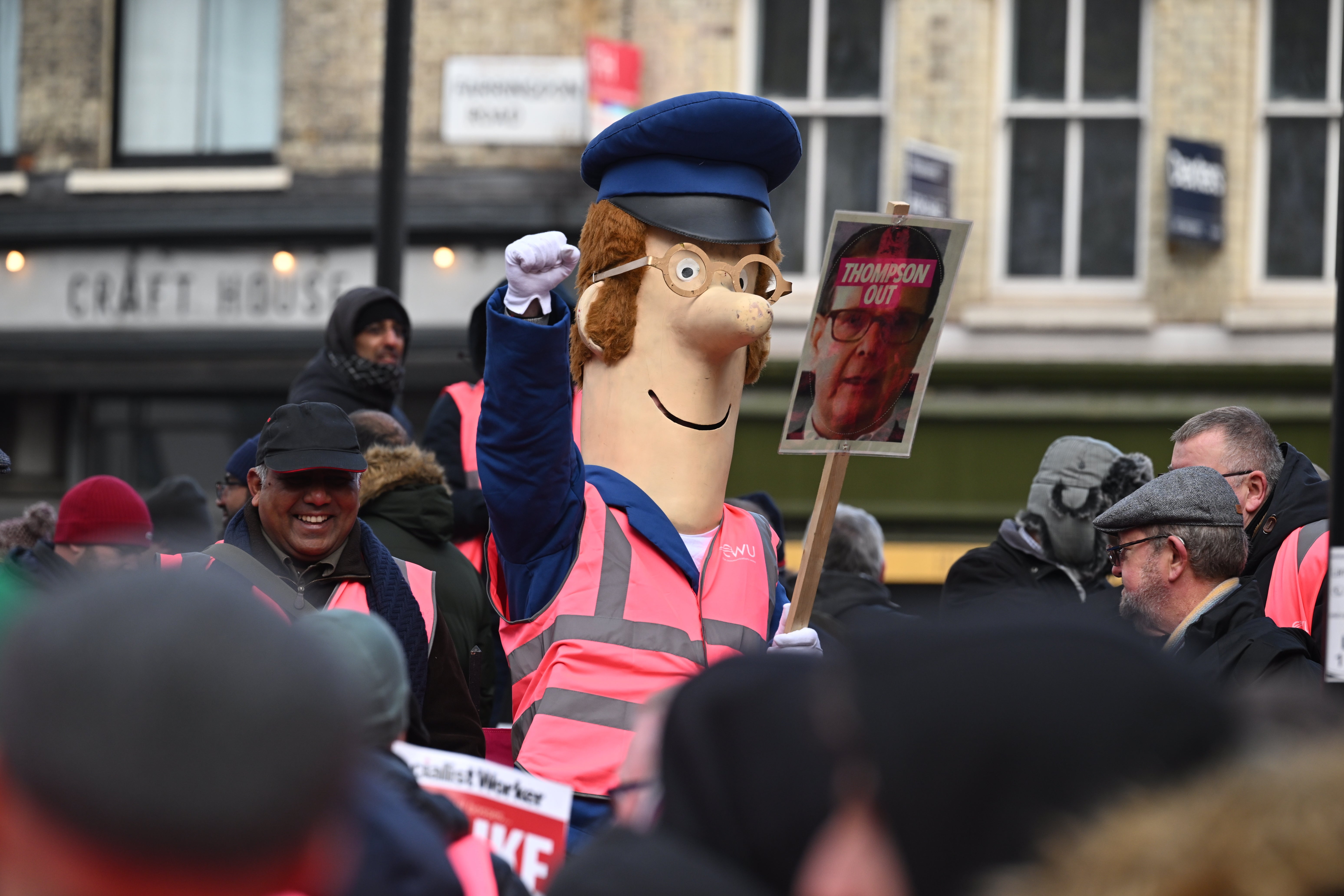 A demonstrator dresses as Postman Pat at Parliament Square rally
