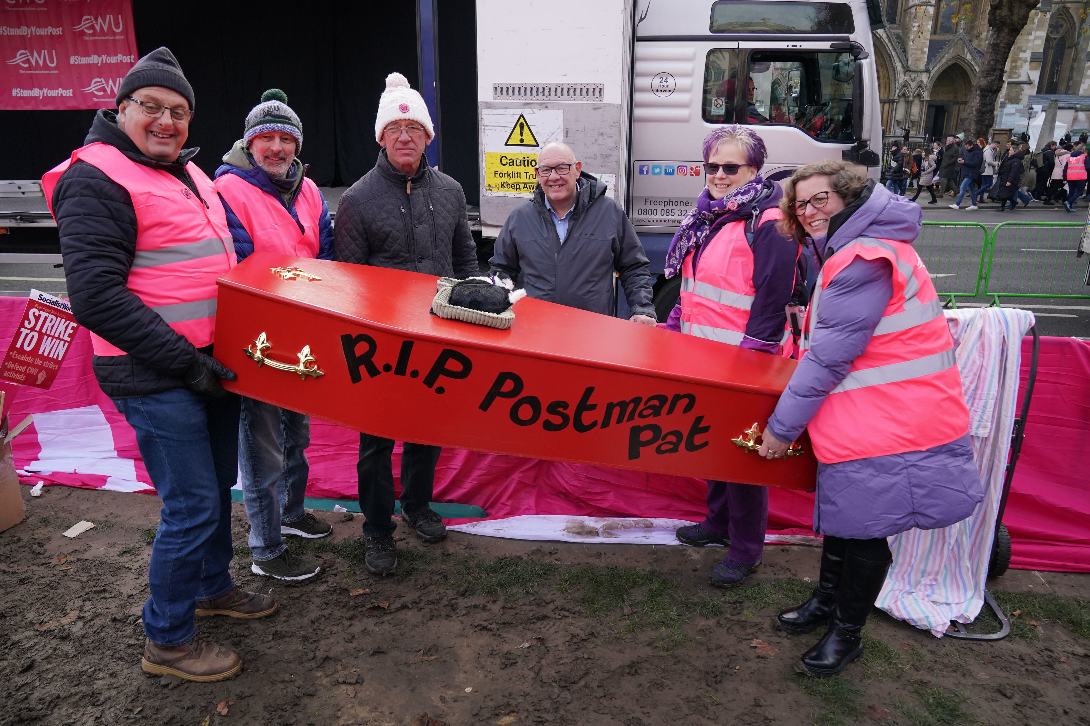 Striking postal workers hold coffin reading ‘R.I.P Postman Pat’ at Parliament Square rally