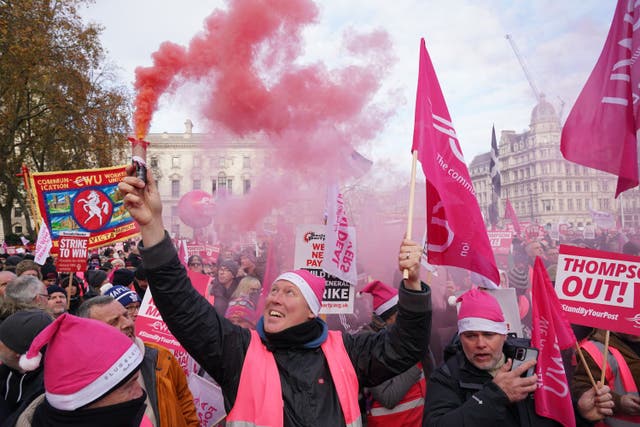 Members of the Communication Workers Union hold a rally in Parliament Square (Jonathan Brady/PA)
