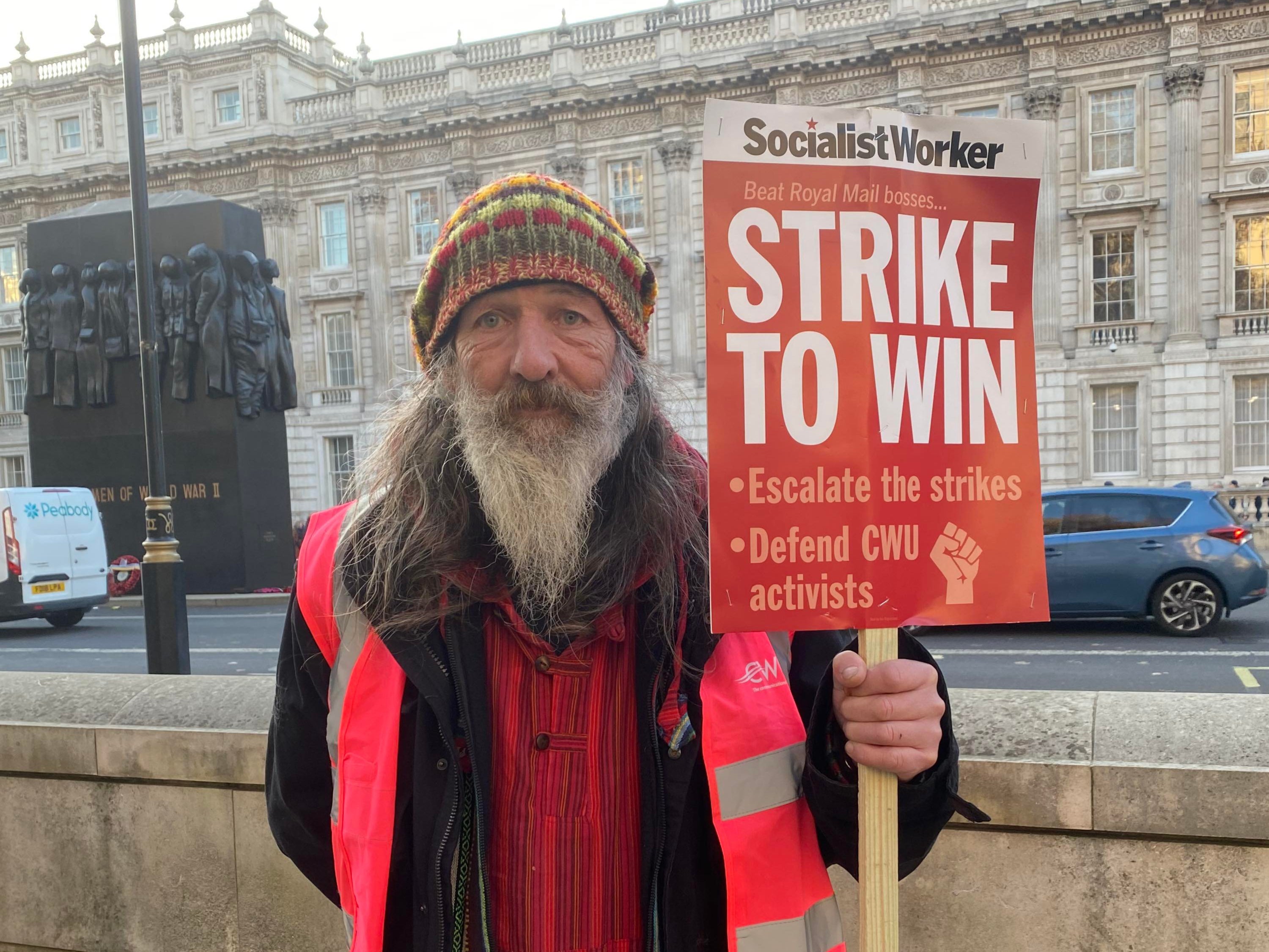 Striking postal worker Andy Coldwell (59) at Parliament Square rally on 9 December 2022.