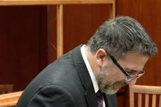 Ex-NYPD officer sobs as he is sentenced to life for murder of eight-year-old son who froze to death in garage