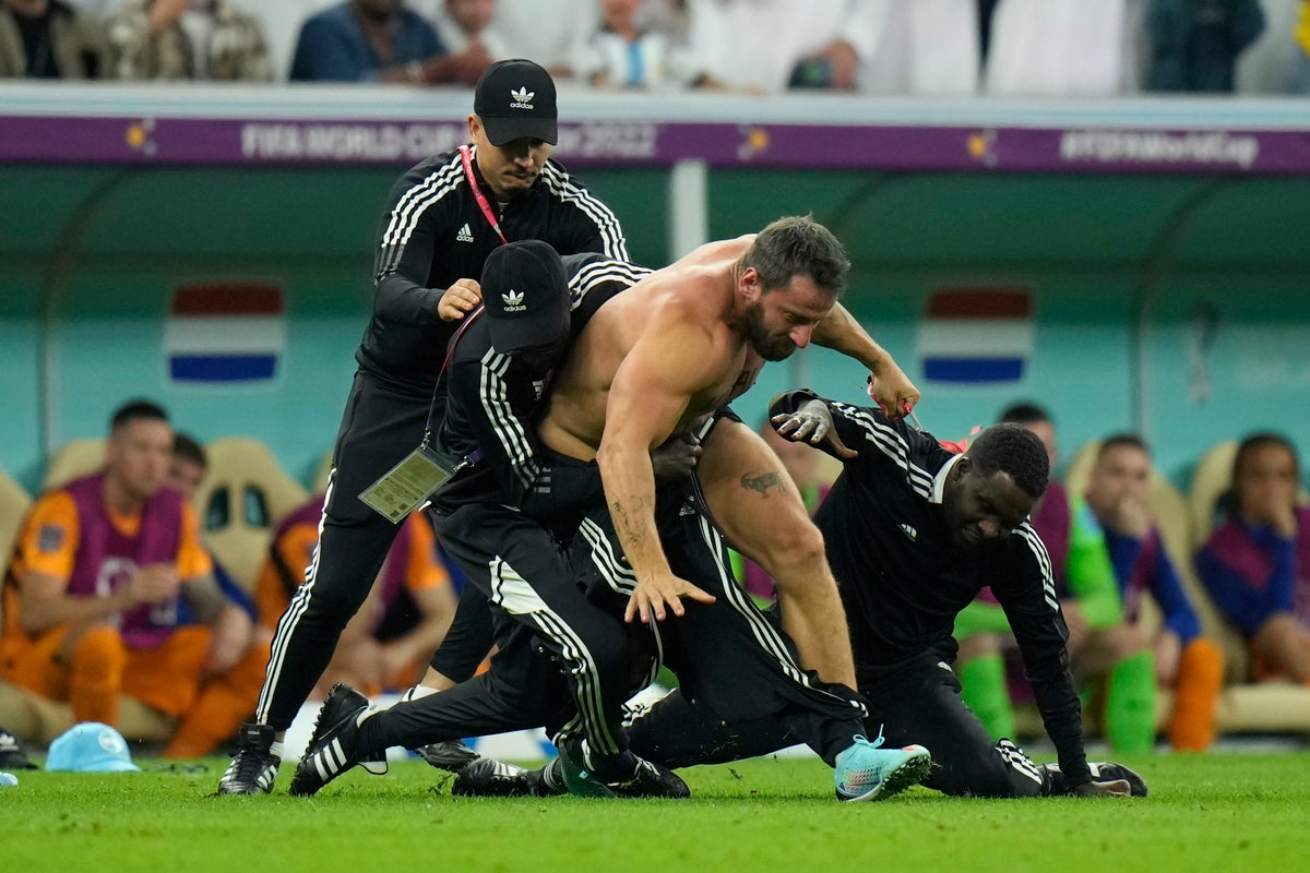 Fan runs on field during Argentina-Netherlands at World Cup