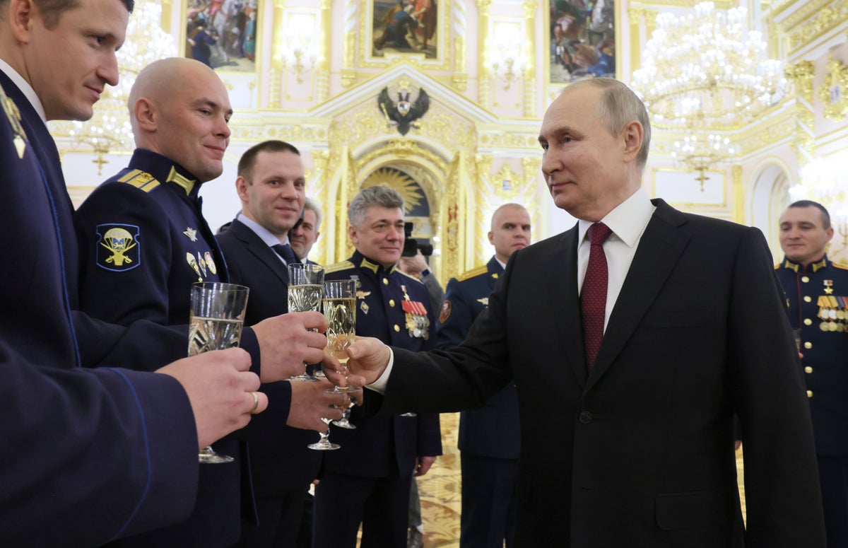 Champagne-sipping Putin says ‘they started it’ to justify Russian strikes on Ukraine energy