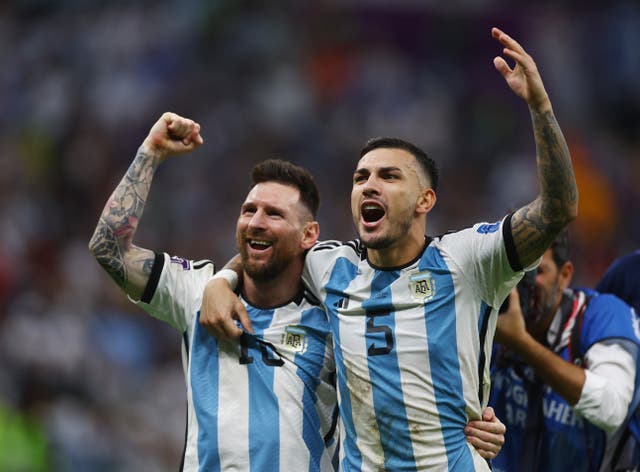 <p>Argentina's Lionel Messi and Leandro Paredes celebrate</p>