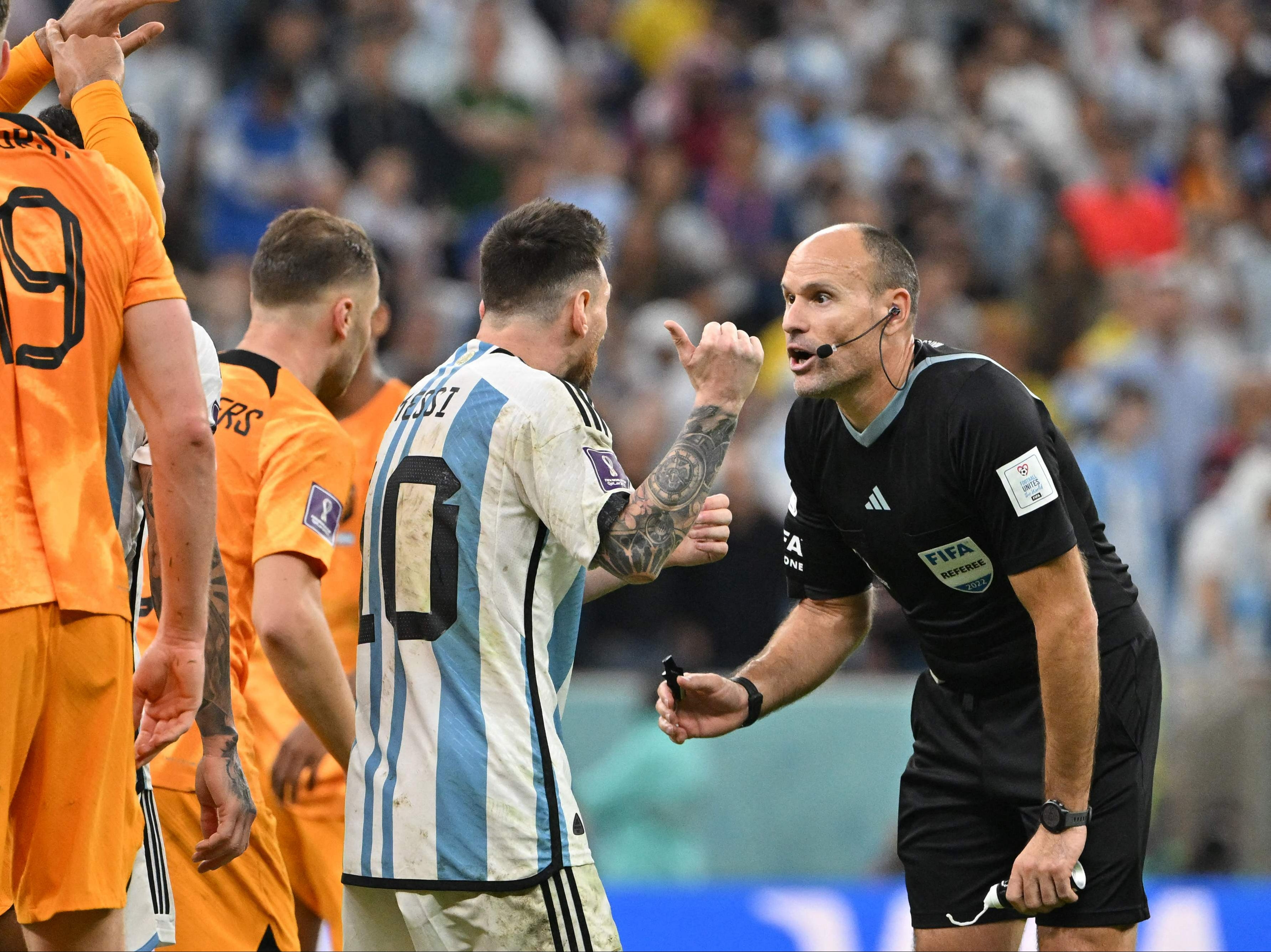 Argentina's forward #10 Lionel Messi argues with Spanish referee Antonio Mateu Lahoz