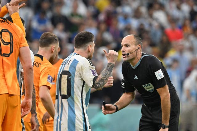 <p>Argentina's forward #10 Lionel Messi argues with Spanish referee Antonio Mateu Lahoz</p>