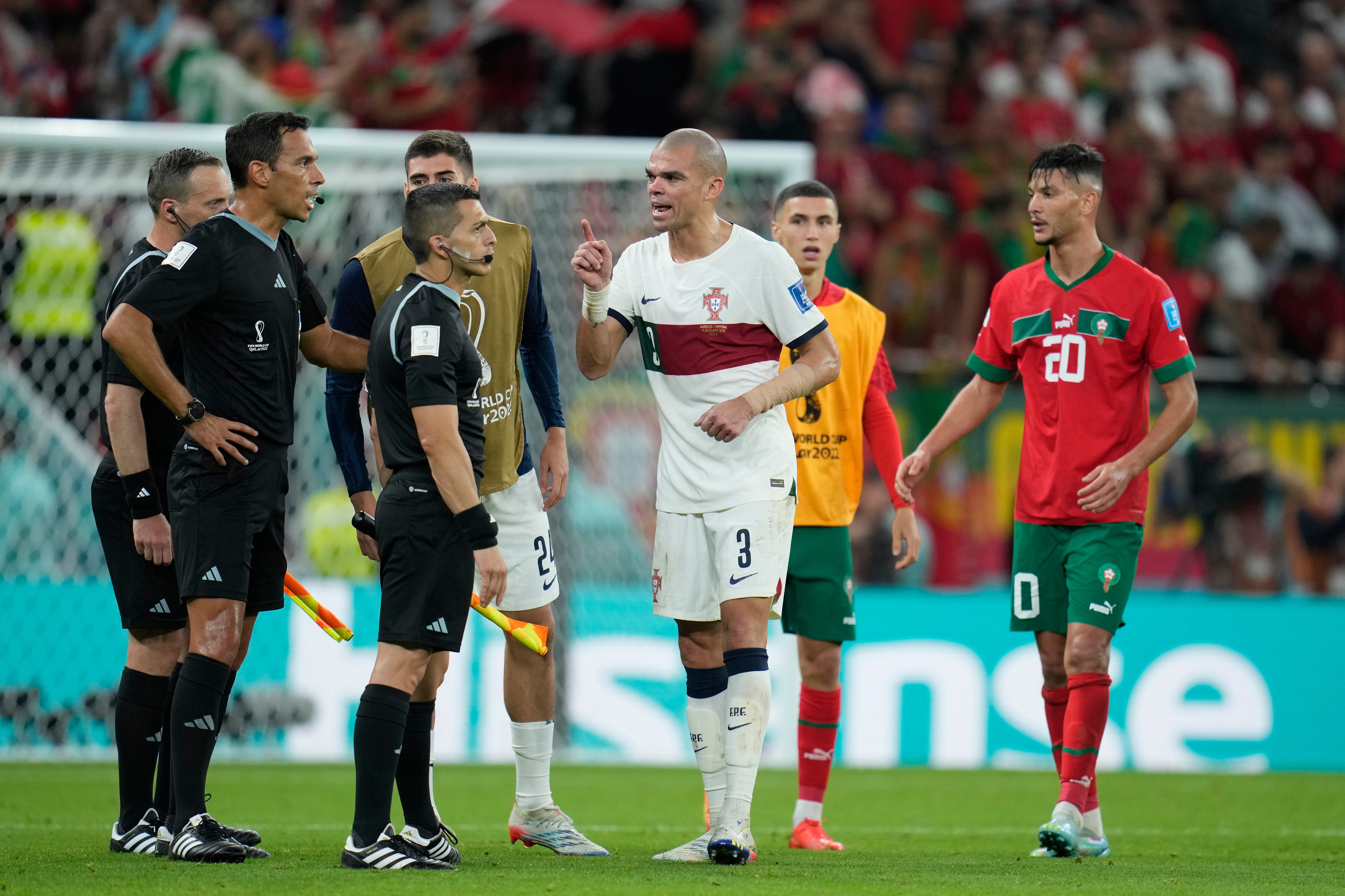 Portugal's Pepe talks to referee Facundo Tello from Argentina