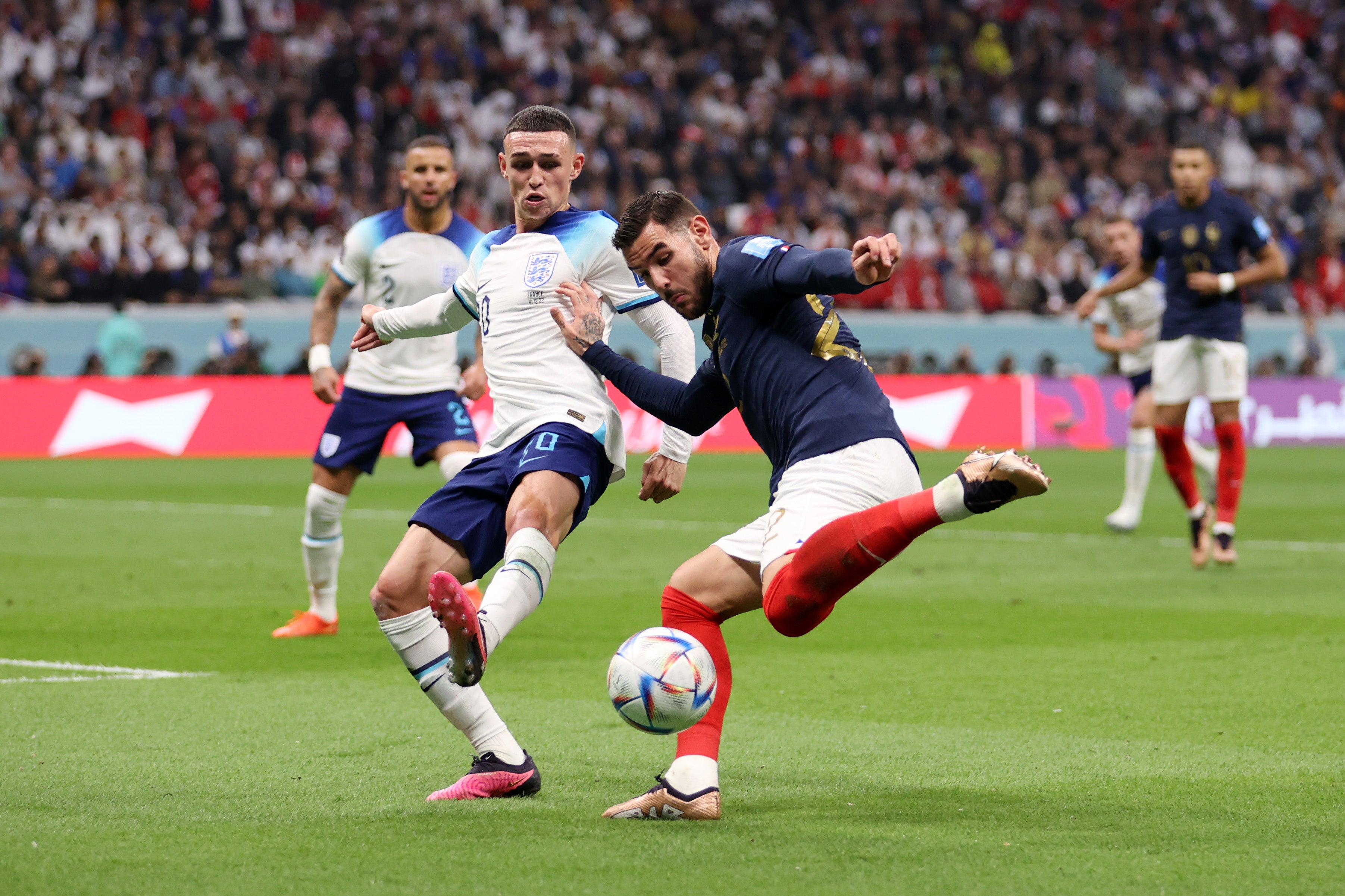 Theo Hernandez of France controls the ball against Phil Foden