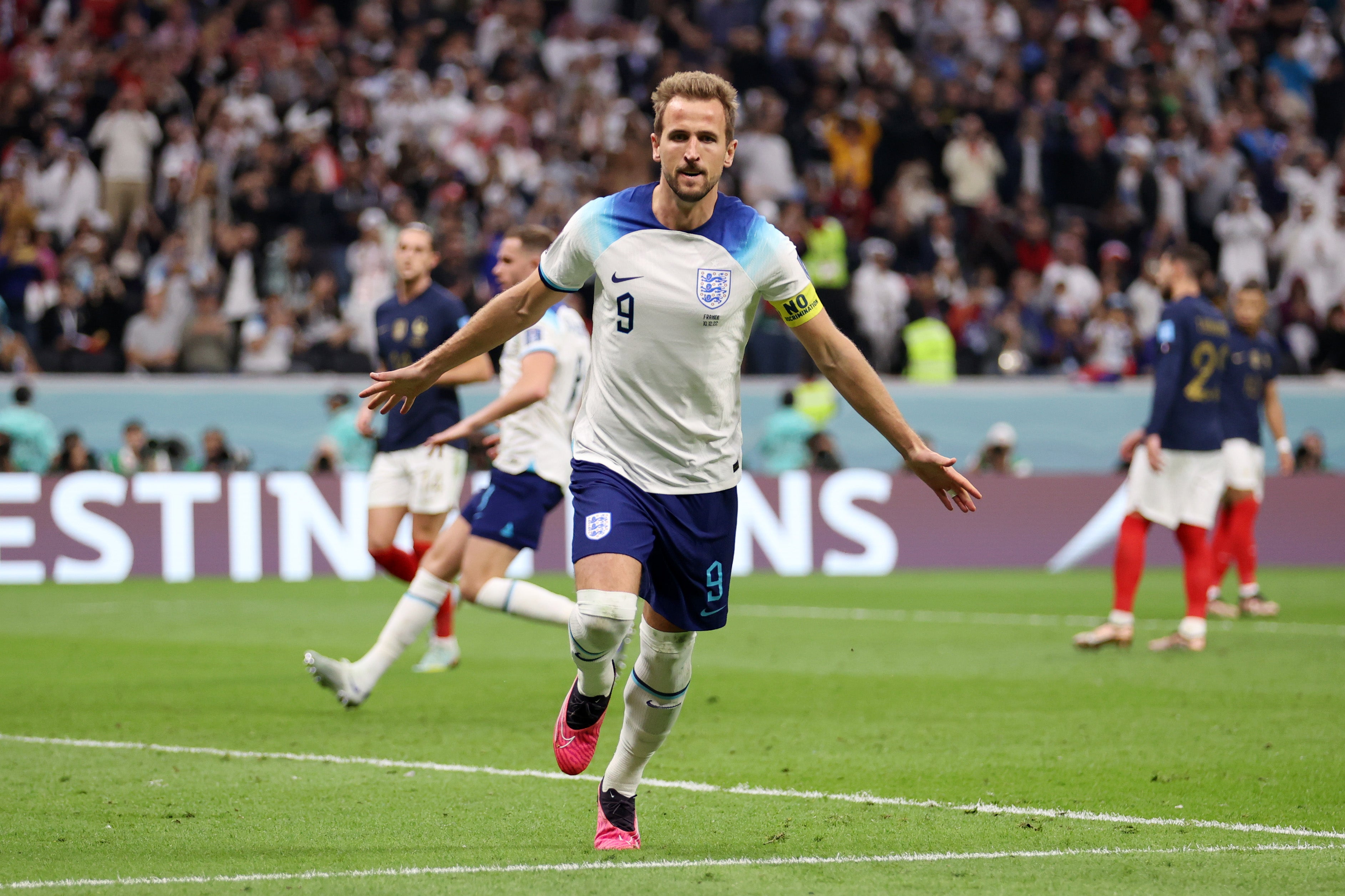 Harry Kane of England celebrates after scoring the team's first goal