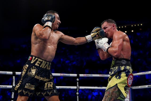 Luis Alberto Lopez (left) and Josh Warrington in action in their IBF featherweight world title fight (Tim Goode/PA)