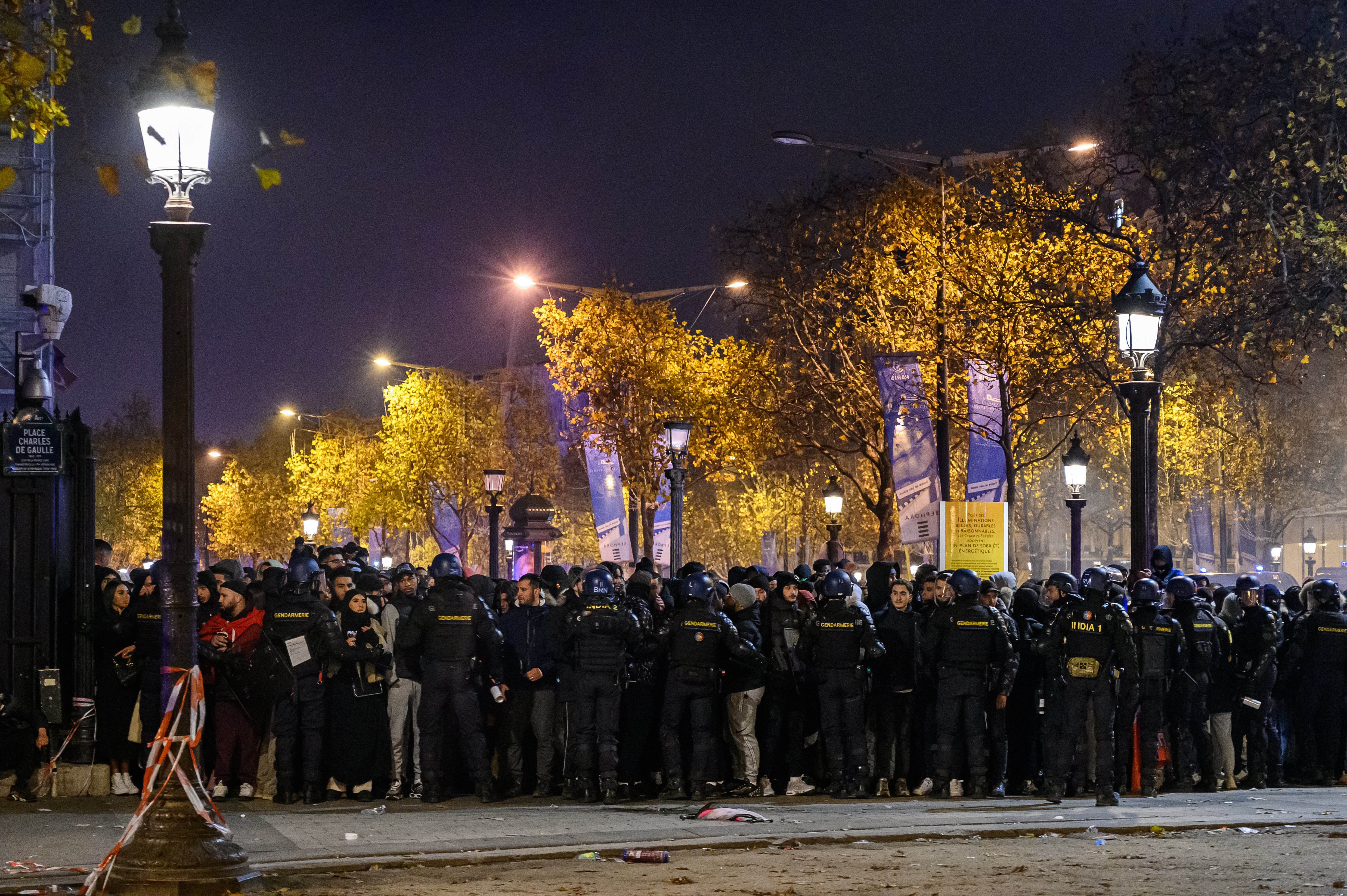 Policeman intervene while the Moroccan fans that celebrate in Champs Elysees