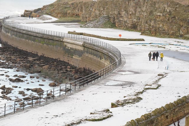 Travel disruption is expected during Monday’s morning rush-hour as yellow warnings of ice, fog and snow are in place for much of the UK (Owen Humphreys/PA)