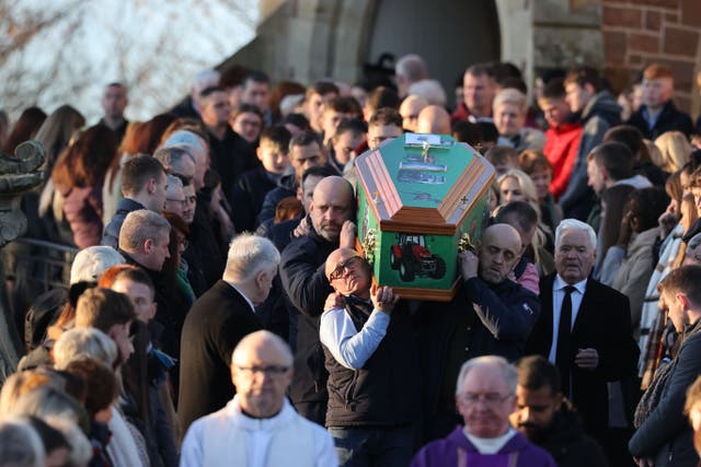 The coffin of Matthew McCallan is taken from St Malachy’s Church, Edendork following his funeral (Liam McBurney/PA)