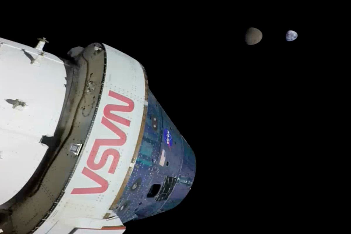 Nasa’s Orion capsule splash-lands in ‘textbook’ return to Earth from the Moon