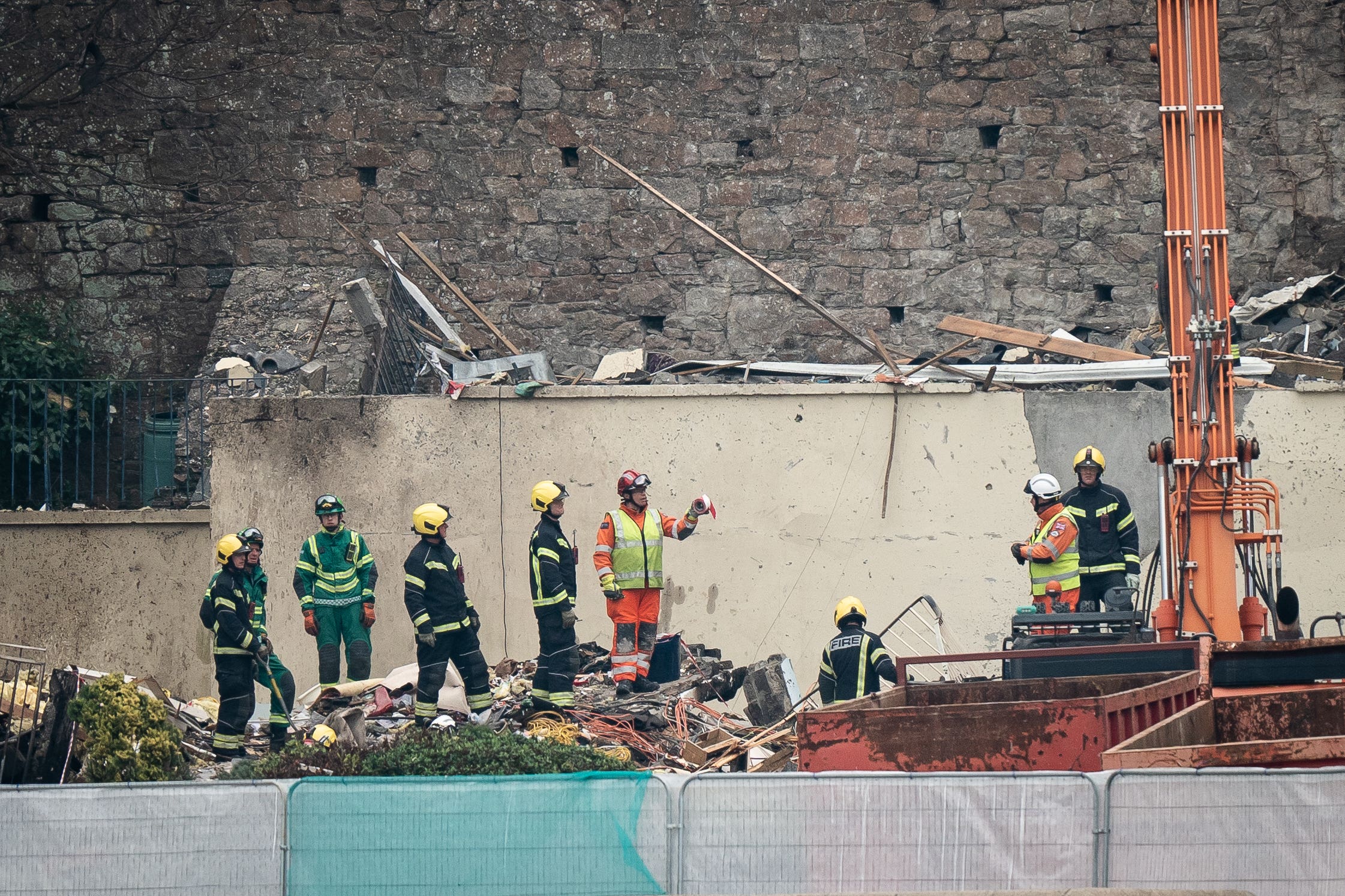 Specialist rescue teams at the scene of an explosion and fire at a block of flats in St Helier, Jersey (Aaron Chown/PA)